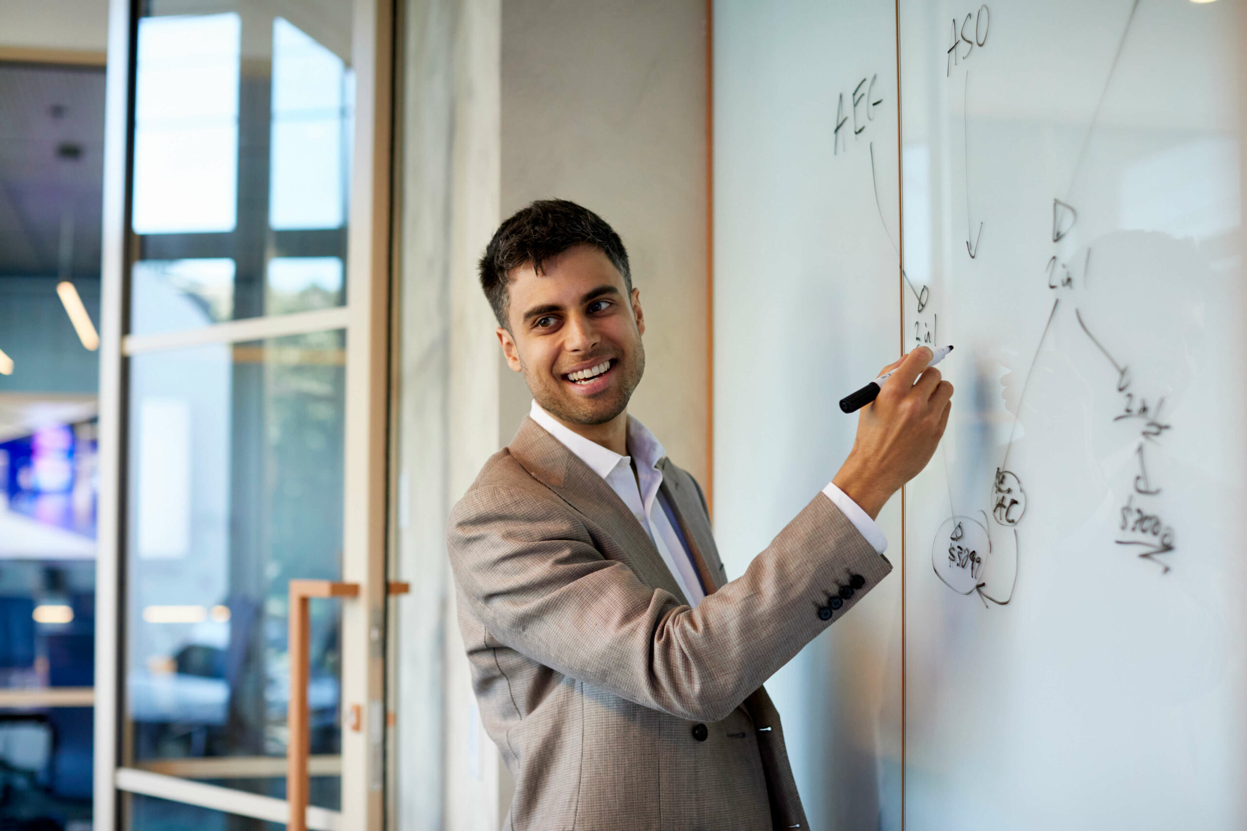 A lawyer using a whiteboard to easily explain a concept.