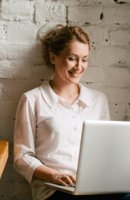 A small business client working on her laptop.